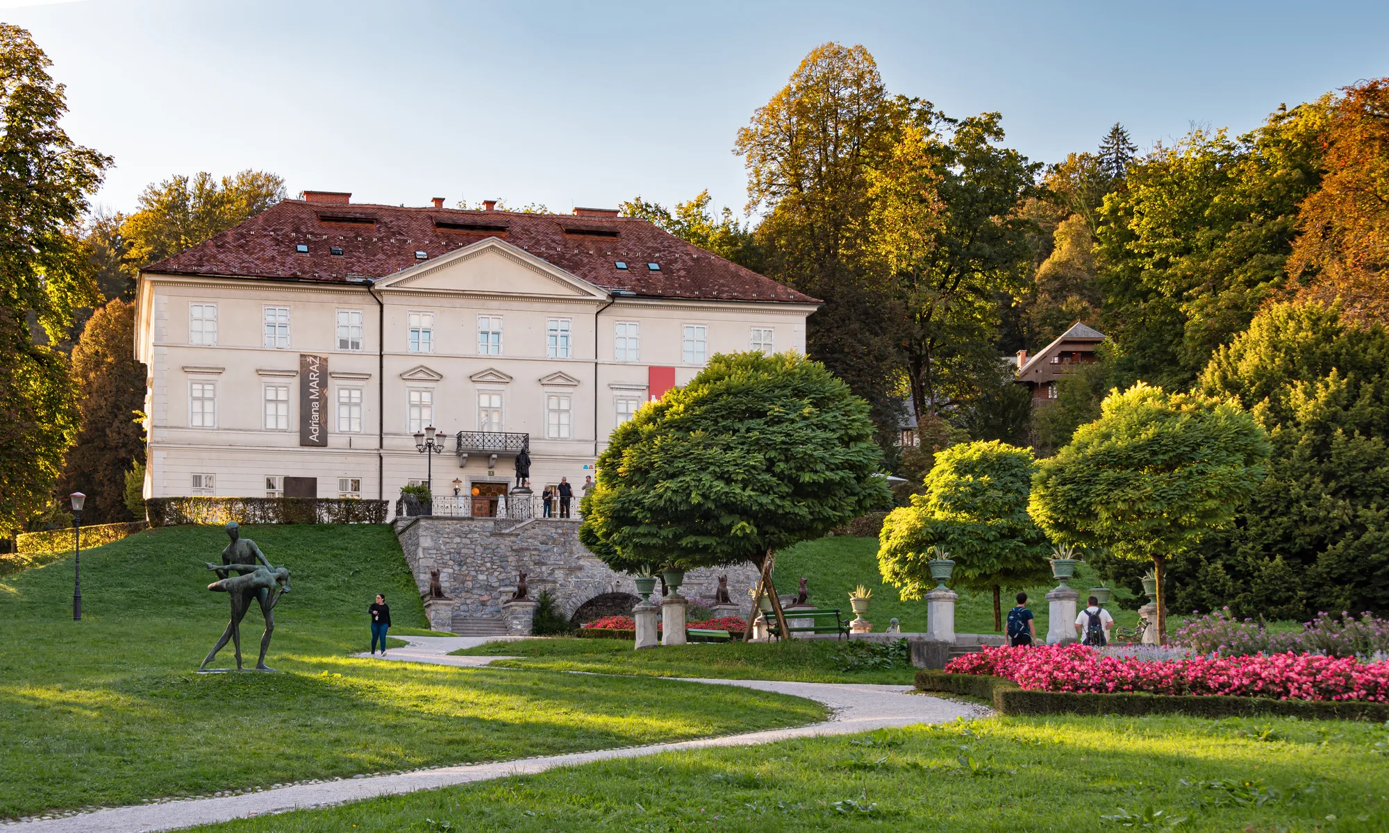 The pale baroque Tivoli Mansion (Tivoli Castle) at the head of the Jakopič Promenade in Ljubljana's Tivoli Park