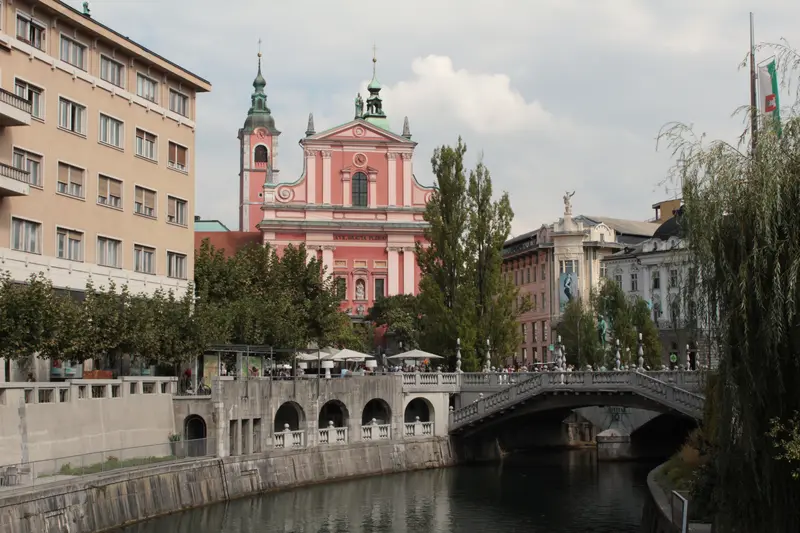 Ljubljana's Triple Bridge and the pink Franciscan Church of the Annunciation